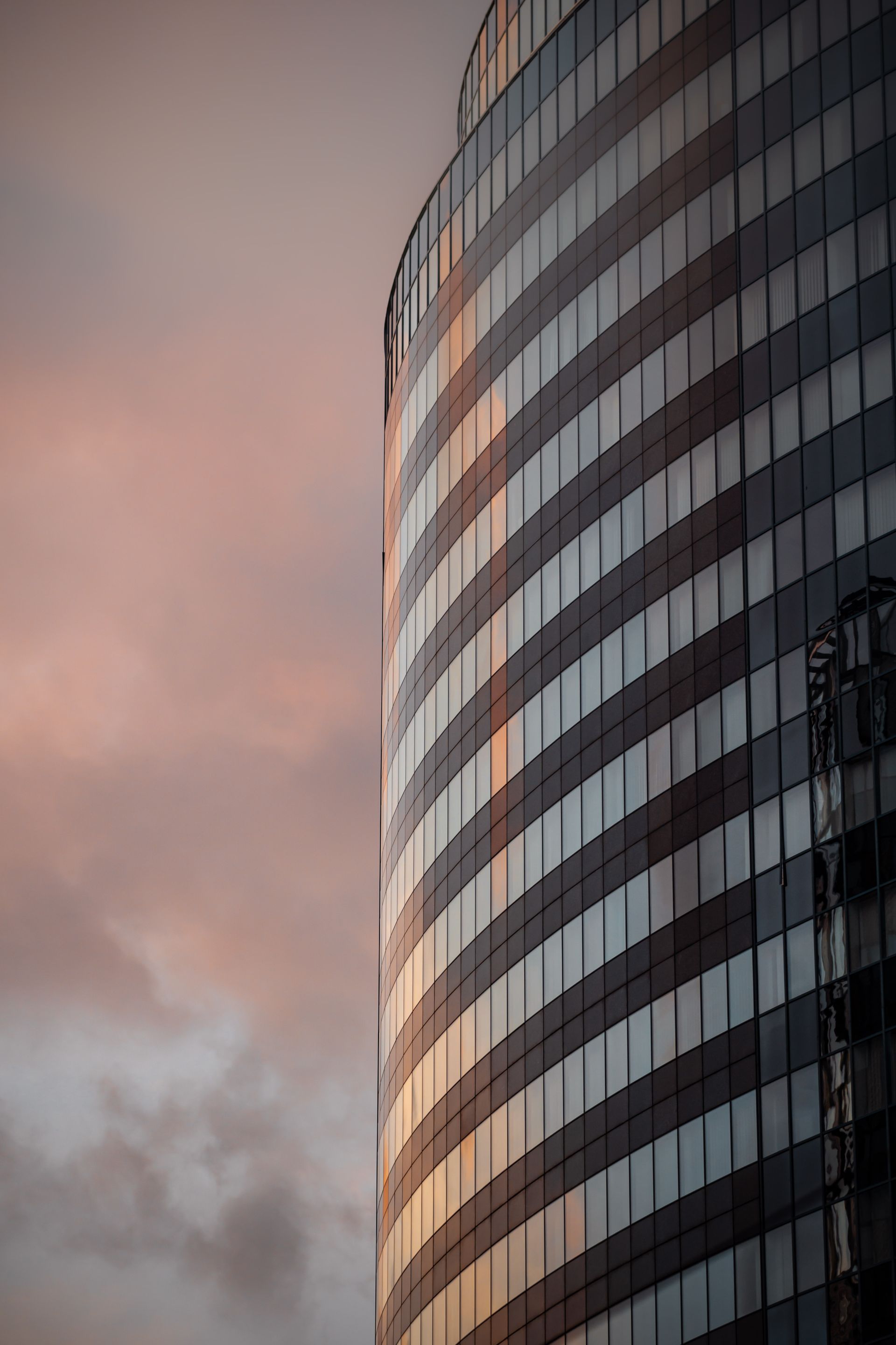 Warm sunset reflected in a contemporary glass building